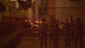 A group of militia, and defected soldiers of the Shitsvillian Armed Forces barricading a road.